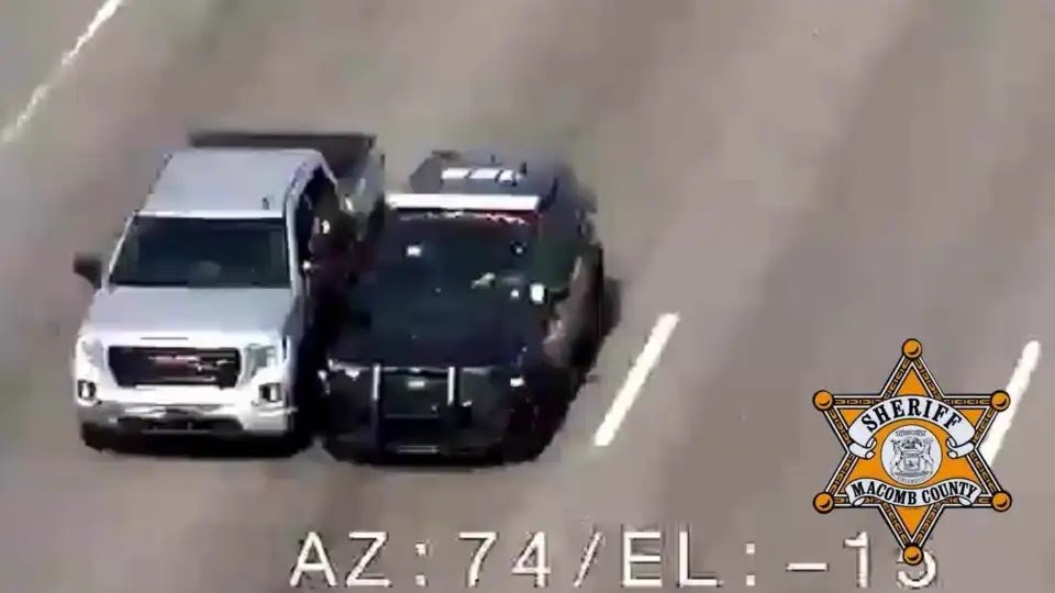 Officer Goes Through Window Of Moving Car To Help Driver