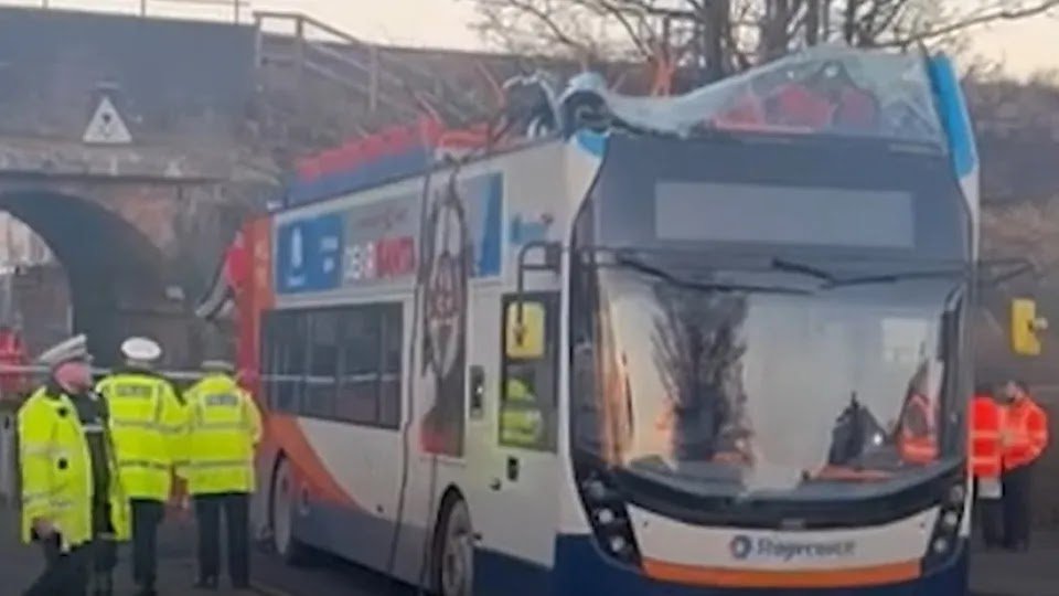 Double-Decker Bus Loses Roof After Crashing Into Bridge