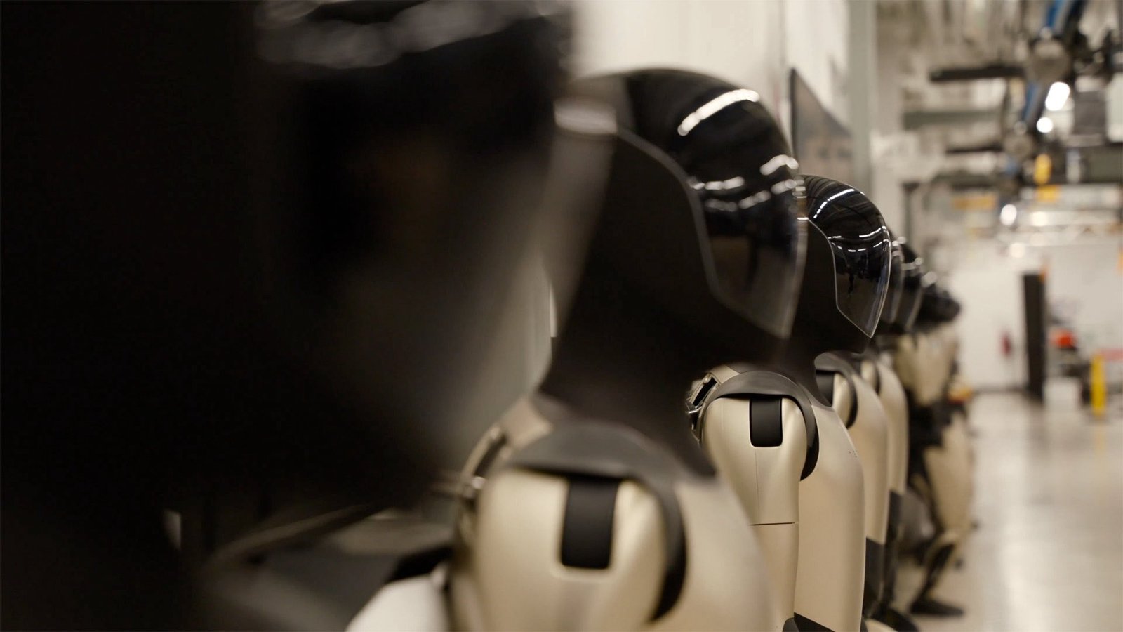 Tesla Optimus Robot Demonstrates Rolling Suitcases at Event with Elon Musk